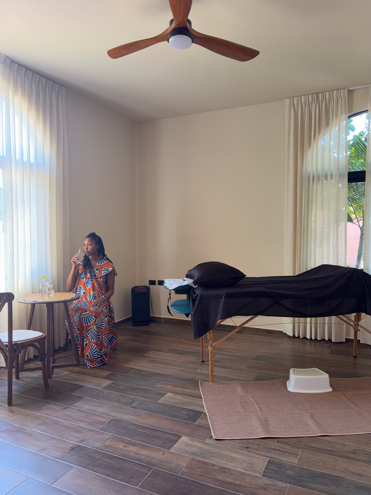 The treatment room at Ixchel-Balam Sanctuary Campus, with arched windows and a treatment table.